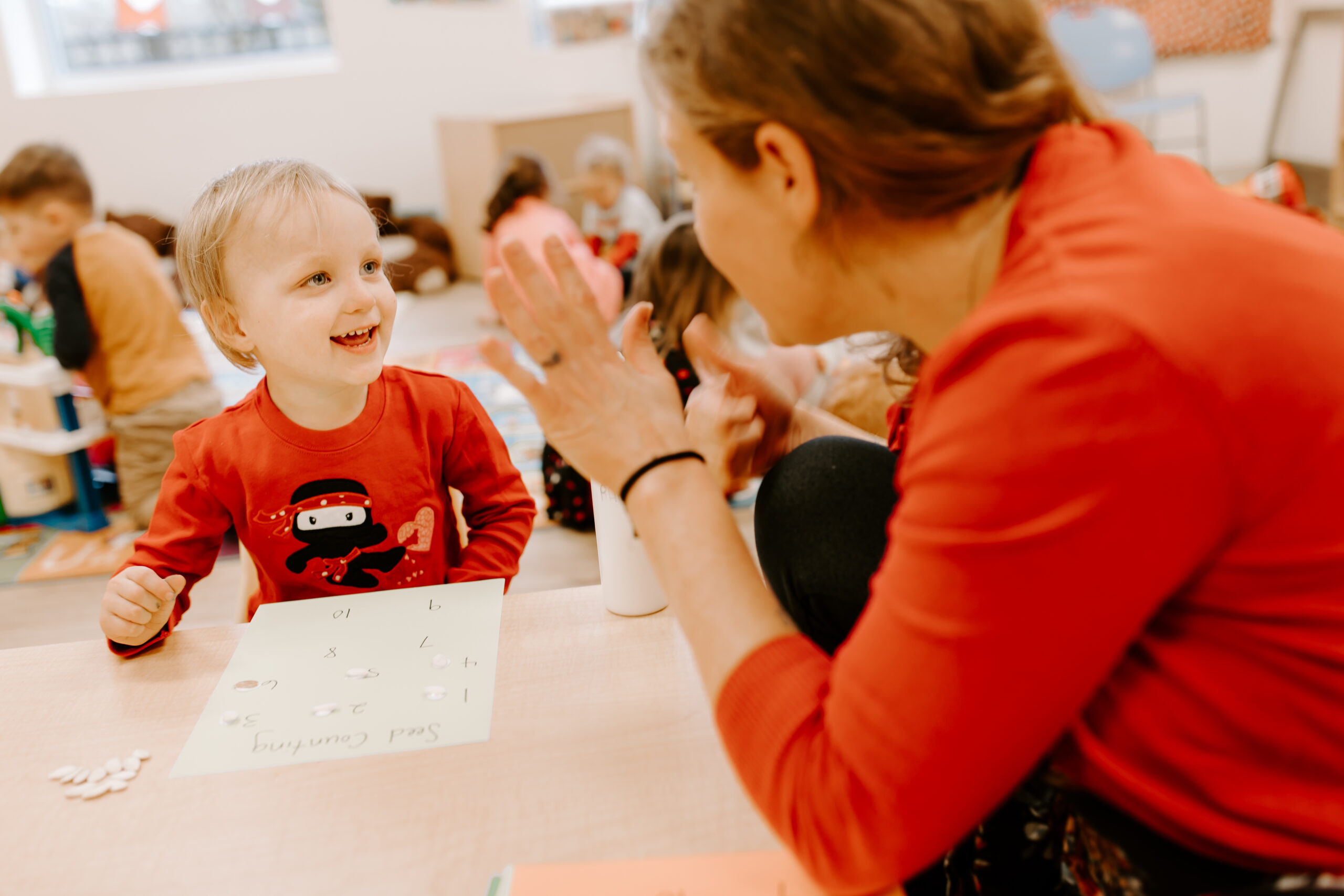 A teacher with a smiling student