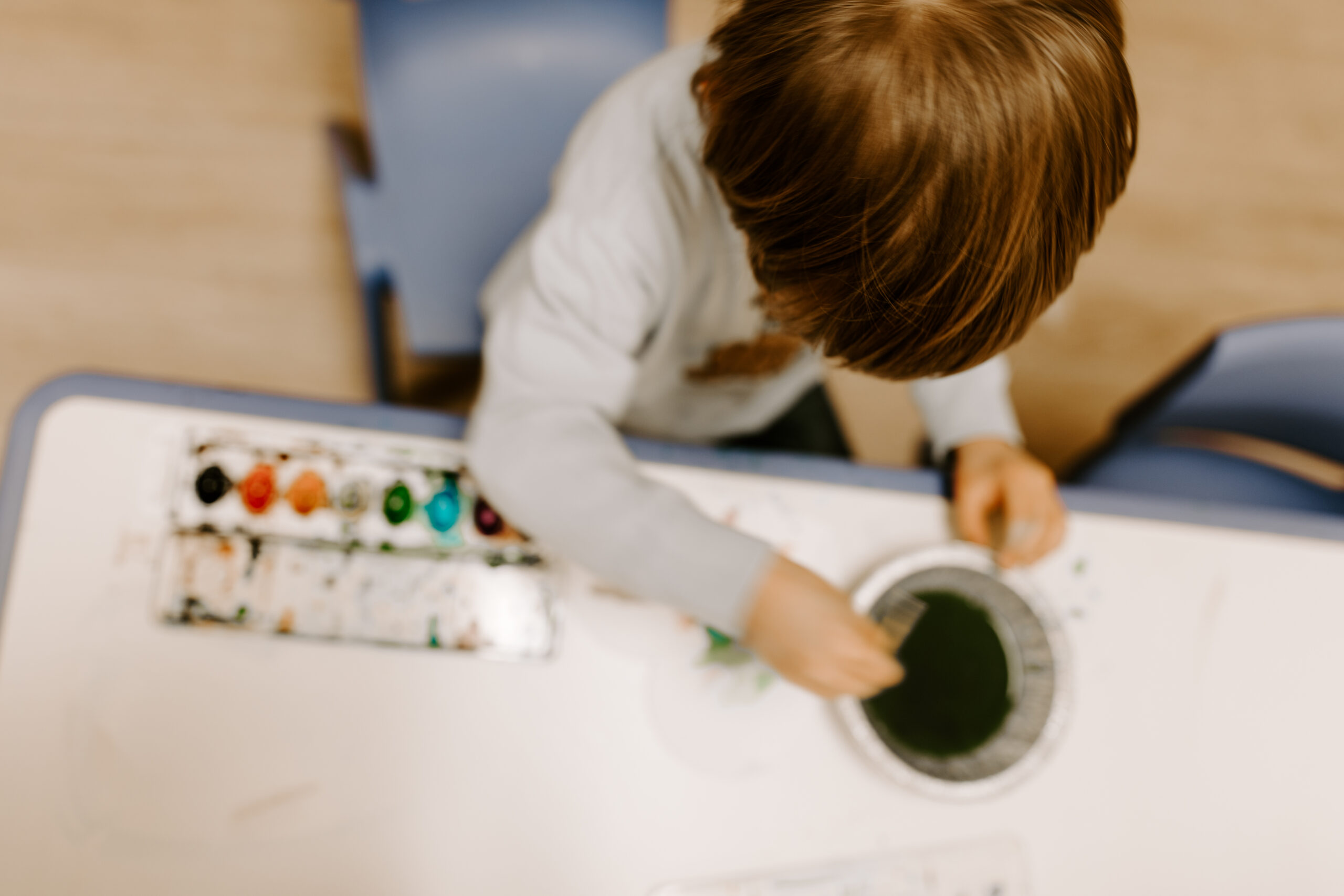 A student using watercolors