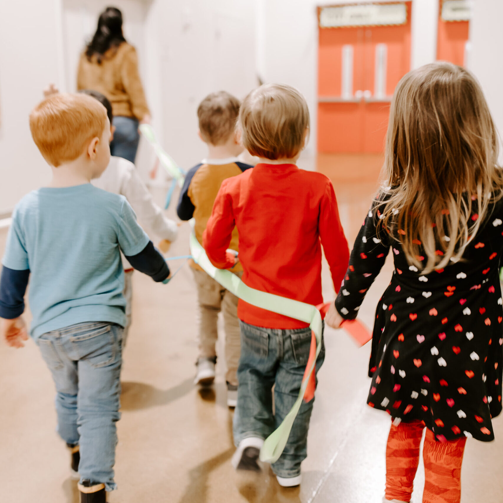 Kids following the line leader